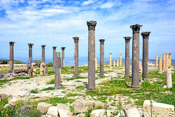 Byzantine Church terrace at Umm Qais, Jordan Umm Qais (Mother of Qais), sometimes transliterated as Umm Qays, is a town in northern Jordan near the site of the ancient town of Gadara. It is situated in the extreme north-west of the country, where the borders of Jordan, Israel and Syria meet, perched on a hilltop 378 metres (1,240 ft) above sea level, overlooking the sea of Tiberias, the Golan heights and the Yarmuk gorge. The Hellenistic-Roman town of Gadara was also sometimes called Antiochia or Antiochia Semiramis or Seleucia. The ancient walls may now be traced in almost their entire circuit of 3 km. The ruins include those of "baths, two theaters, a ippodrome, colonnaded streets and, under the Romans, aqueducts, a temple, a basilica and other buildings, telling of a once splendid city.  architectural stele stock pictures, royalty-free photos & images