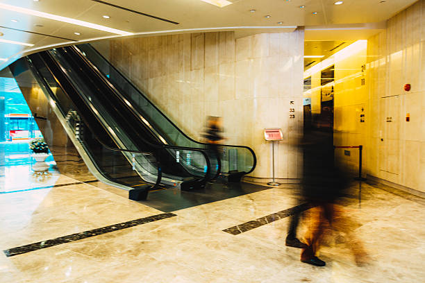 istock Business concept shoppers walking in a mall 472939380