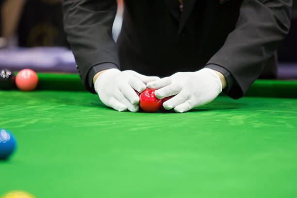 Snooker referee set up ball for new game