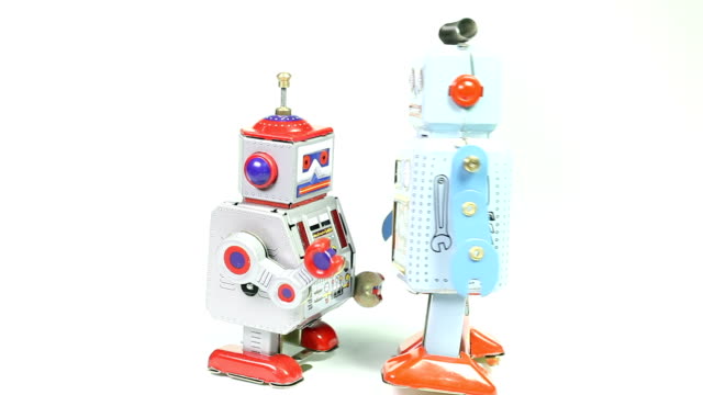 Two fighting retro tin toy robots