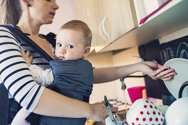 istock Mother washing up dishes 472942472