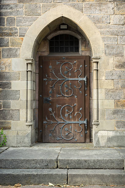 istock Old medieval church doorway, with ornate ironwork, Hannover, Germany 472942810