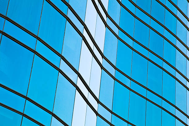 istock Modern office architecture at blue glass curtain wall backgrounds 472946542