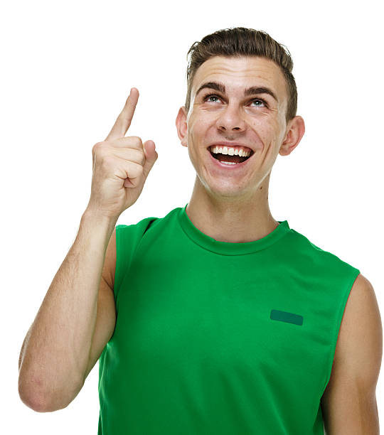istock Cheerful male athlete pointing up 472949078