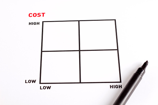 A black cutting mat with a white grid is isolated on a white background.
