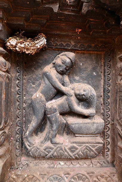 Erotic carvings on Hindu temples in Kathmandu, Nepal Kathmandu, Nepal - October 10, 2013: Erotic carvings on Hindu temples, now destroyed after the massive earthquake that hit Nepal on April 25, 2015 lingam yoni stock pictures, royalty-free photos & images