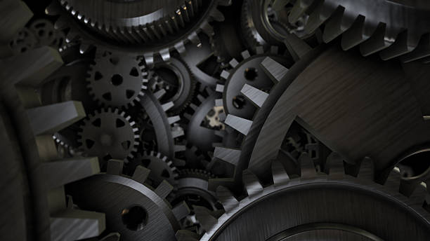 istock Big metal gears on glossy black background 472953890