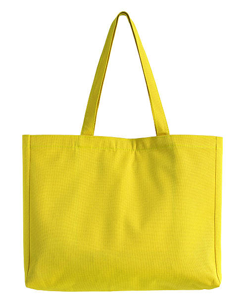 istock yellow fabric bag isolated on white 472953960