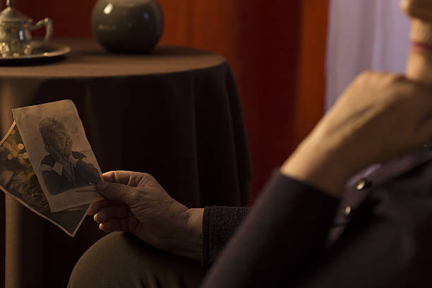 istock Grandmother looking at grandson picture 472954238