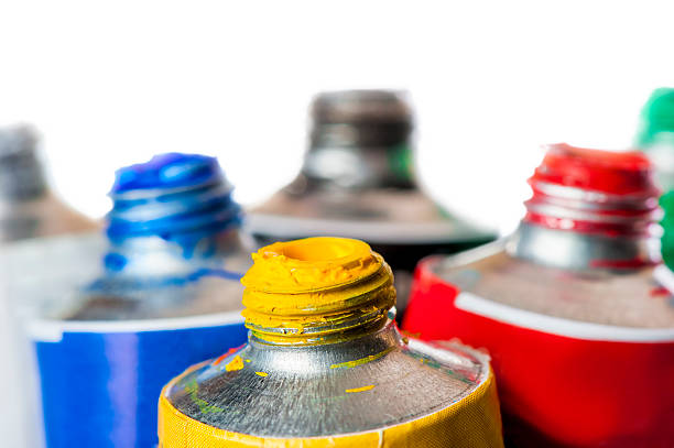 istock Focus on a yellow tube with acrylic paint 472957344
