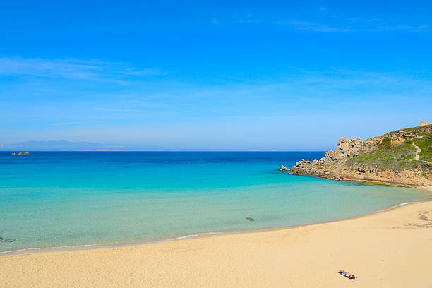 istock girl alone in a tropical beach 472958000