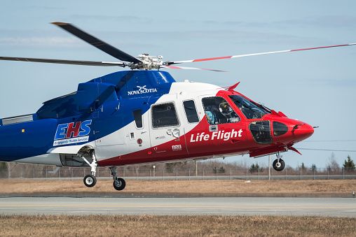 Goffs, Canada - May 3, 2015: An Emergency Health Services Life Flight helicopter lifts off from Halifax Stanfield International Airport.