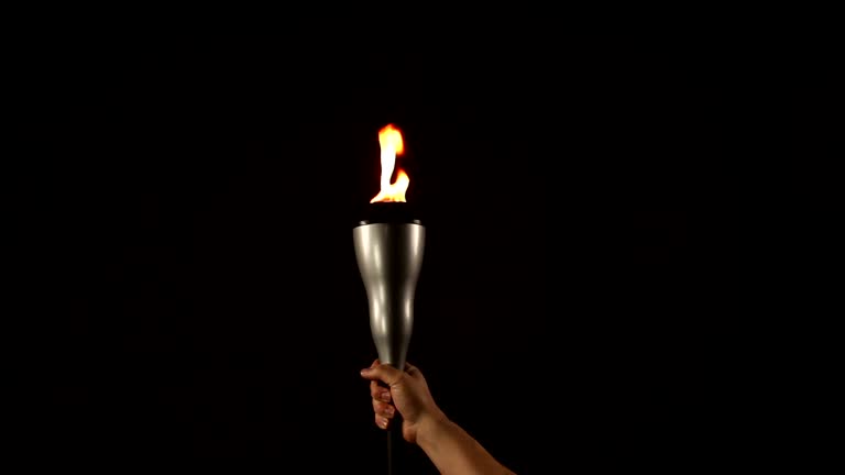 Holding a flaming torch