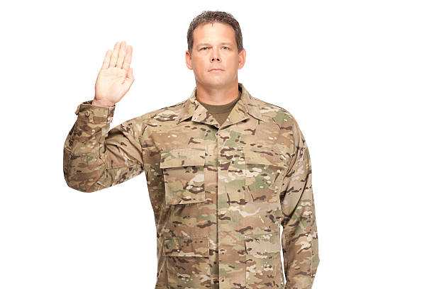istock U.S. Army Soldier, Sergeant. Isolated with arm raised. 472961178