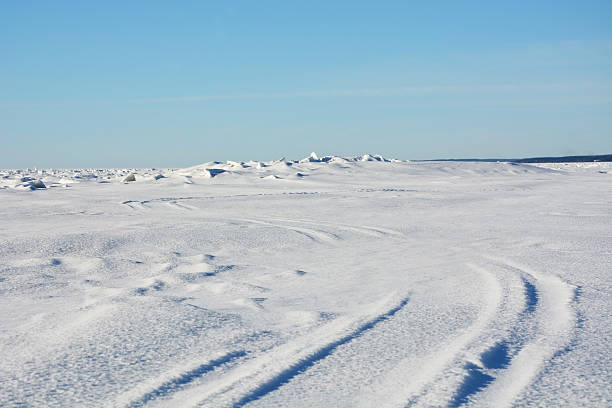 istock Frozen sea landscape at sunny day with sky tracks 472961322