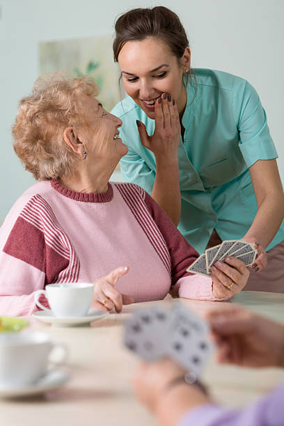 istock Nurse helping with cards 472961358