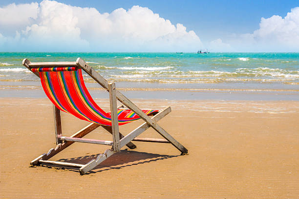 istock beach chair on the beach with clear blue sky. 472962564