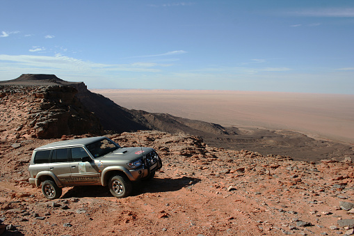 Awbari, Libia- 28 December 2008: the rocky desert Awbari between Ghat and on the border with Algeria, in off-road car on desert rocks climbing over the plateau, the area of ethnic Tuareg