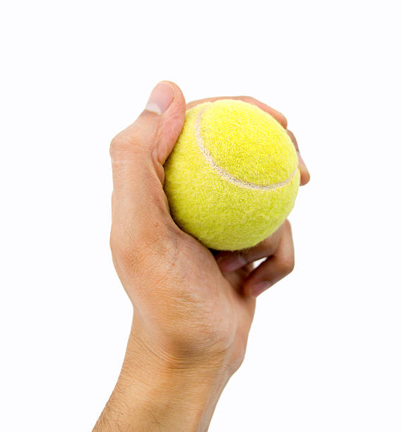 istock holding tennis ball 472966942