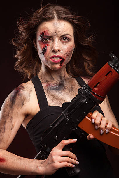 istock Beautiful sexy girl with gun. Posing in studio. 472967010