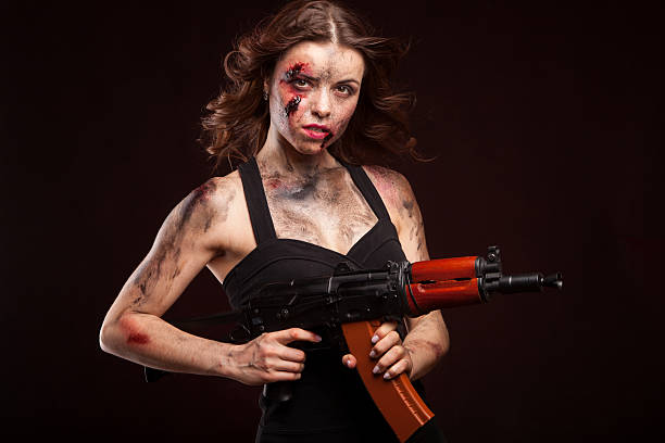 istock Beautiful sexy girl with gun. Posing in studio. 472967014