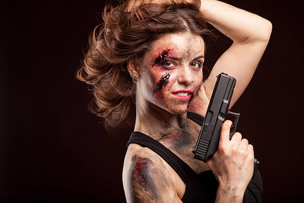 istock Beautiful sexy girl with gun. Posing in studio. 472967218
