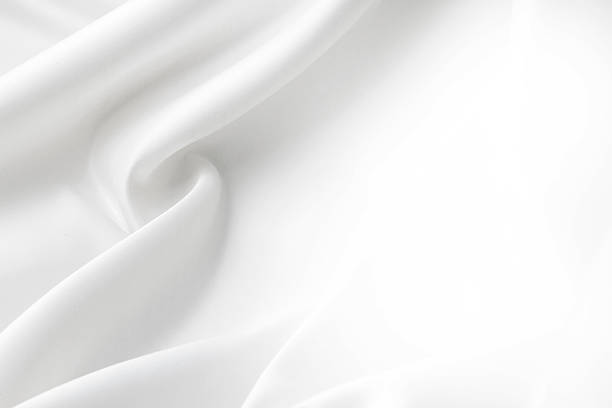 White silk Closeup of rippled white silk fabric bed sheets stock pictures, royalty-free photos & images