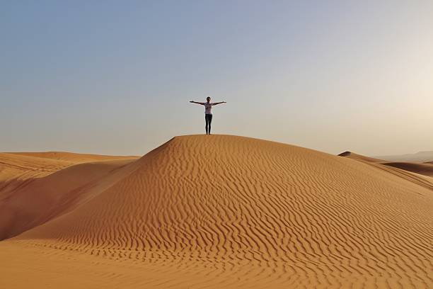 istock girl  in desert 472967302