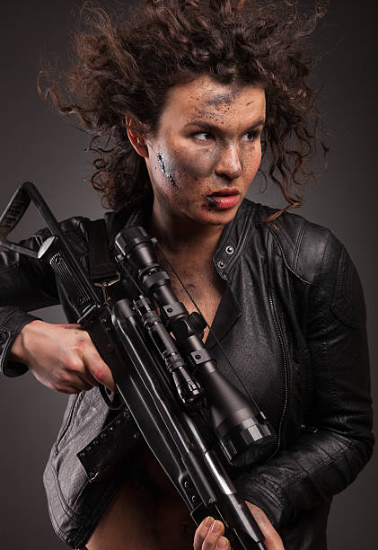 istock Sexy military, killer woman posing with gun. 472969848