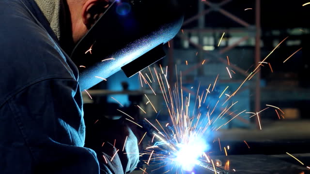 Welder at work in metal industry