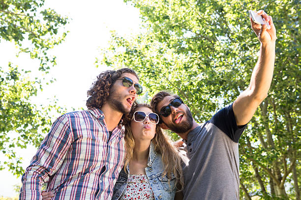istock Happy friends taking a selfie 472970540