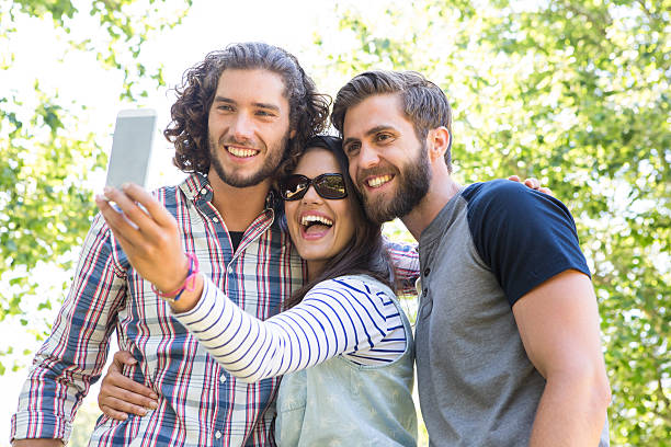istock Happy friends taking a selfie 472970552