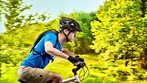 istock Male biker riding bicycle outdoors 472973370
