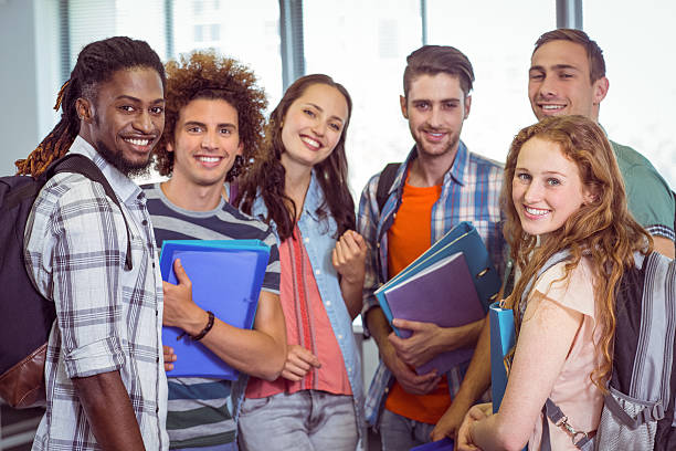 istock Fashion students smiling at camera together 472974280