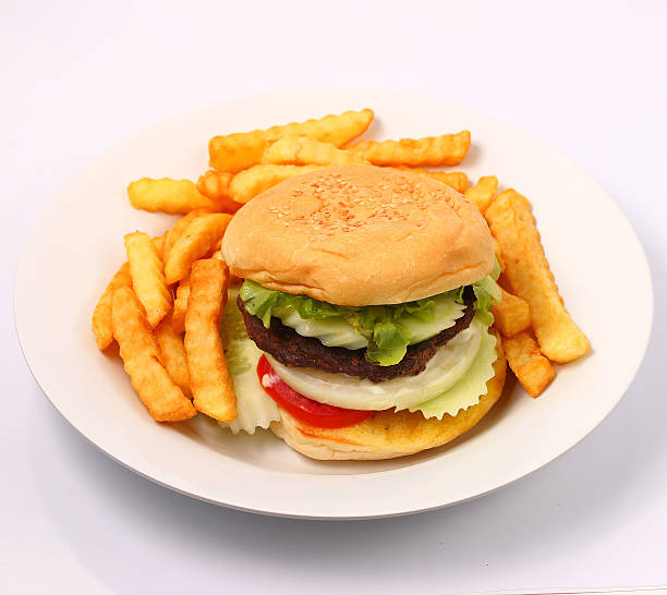 istock hamburger and french fries 472977904
