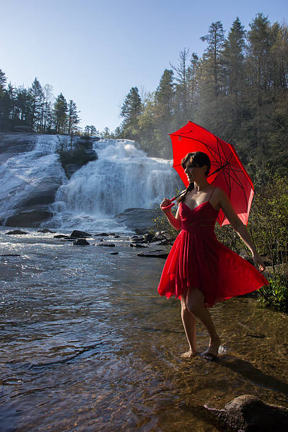 istock Woman wading in stream 472980646
