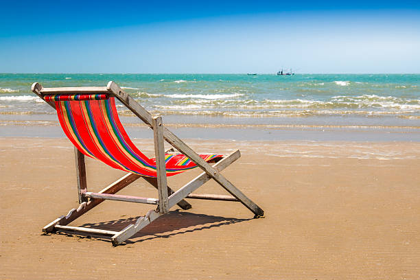 istock Beach chair on the beach with clear blue sky. 472980716