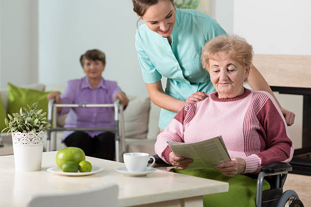 istock Old women and a nurse 472980828