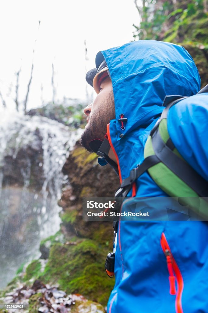 Climbing Mountain Young Man climbing to the top of rock mountain . 2015 Stock Photo