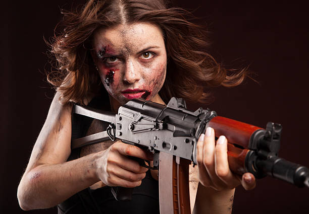 istock Beautiful sexy girl with gun. Posing in studio. 472986866