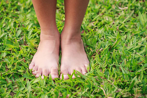 istock Children feet in the park 472991688