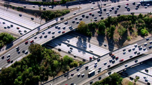 HD 1080p: Overhead shot of busy freeway intersection, Los Angeles.  Shot with a Cineflex gyro-stabilized camera system. 