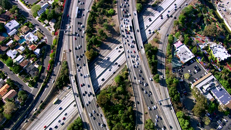 HD 1080p: Overhead shot of busy freeway intersection, Los Angeles. Shot with a Cineflex gyro-stabilized camera system.
