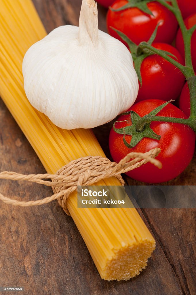 Italian basic pasta ingredients Italian basic pasta fresh ingredients cherry tomatoes garlic 2015 Stock Photo