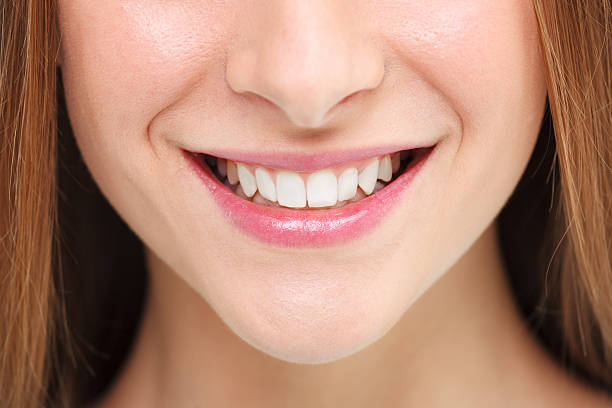 istock Woman smile. Teeth whitening concept. 473003082