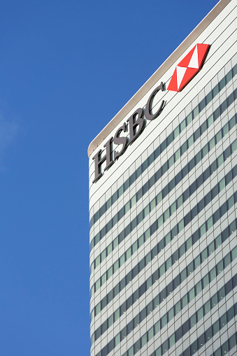 London, UK - October 29, 2013: Corporate branding on the headquarter buildings of HSBC at day in London.
