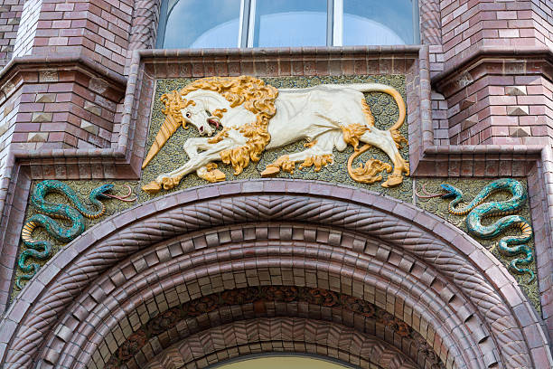 Porcelain unicorn with magic horn on the wall of an old pharmacy in the center of Hanover, Germany. The former “Rathsapotheke” or rather town council pharmacy, a stunning 19th century building right next to the Old Townhall. The unicorn is a legendary animal from European folklore that resembles a white horse with a large, pointed, spiraling horn projecting from its forehead, and sometimes a goat's beard.