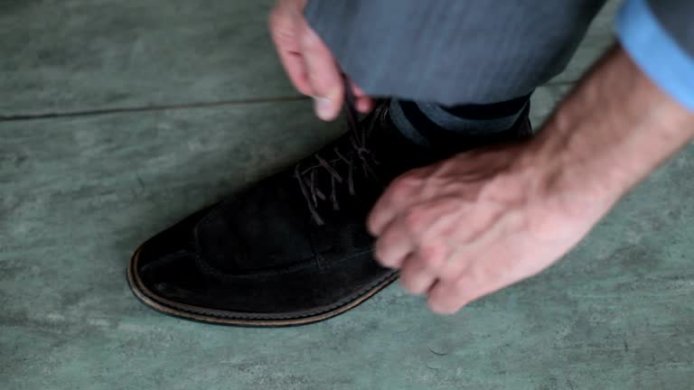 tying the laces of a shoe