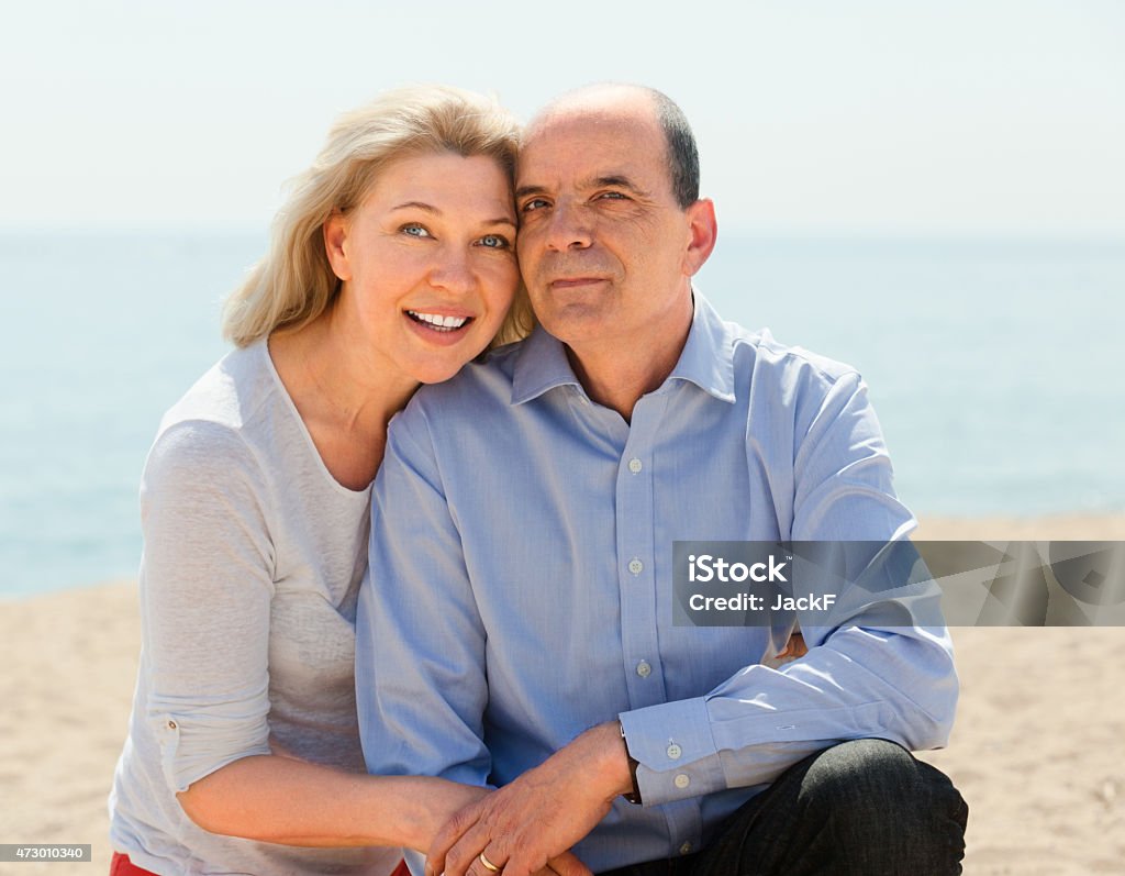 Happy elderly couple spends time Happy elderly couple spends time on seaside 2015 Stock Photo