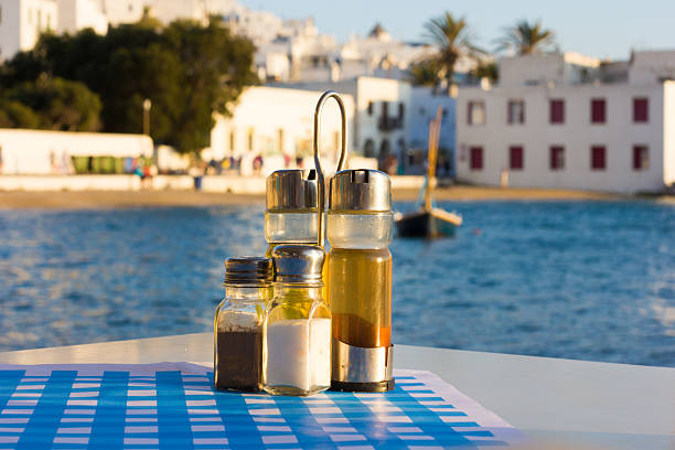 Condiments on a restaurant table in Mykonos Town, including salt and pepper